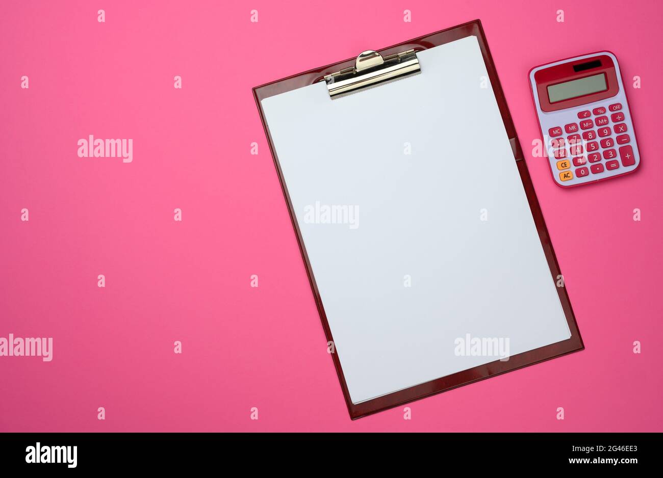Plastic pink calculator and folder with blank white sheets on pink background Stock Photo Alamy