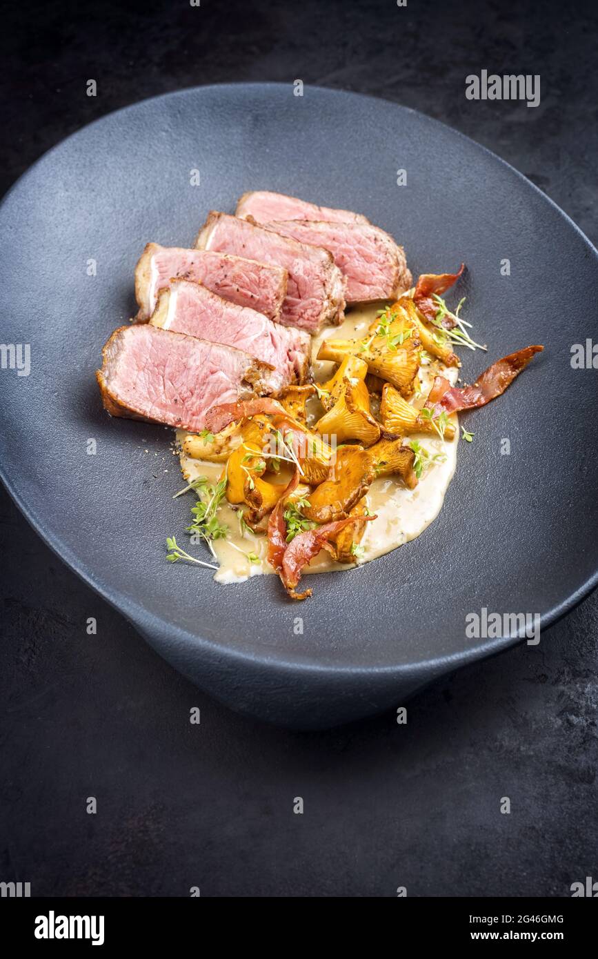 Modern style fried dry aged wagyu roast beef steak with chanterelle and