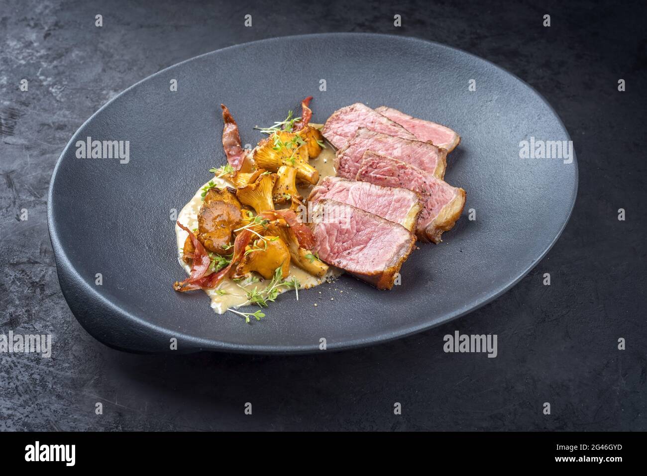 Modern style fried dry aged wagyu roast beef steak with chanterelle and