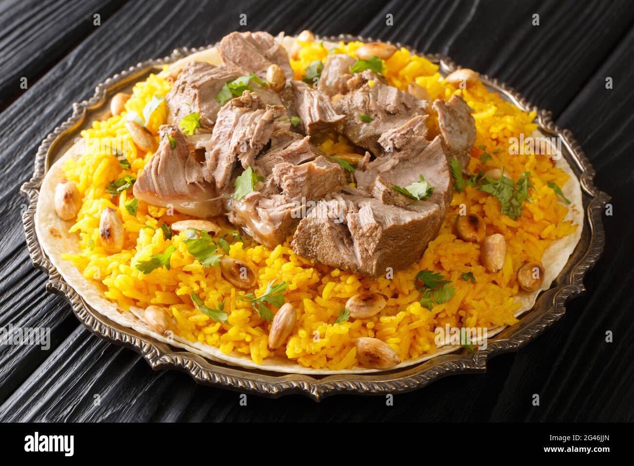Mansaf a feast dish of lamb in yogurt sauce atop flatbread and a bed of