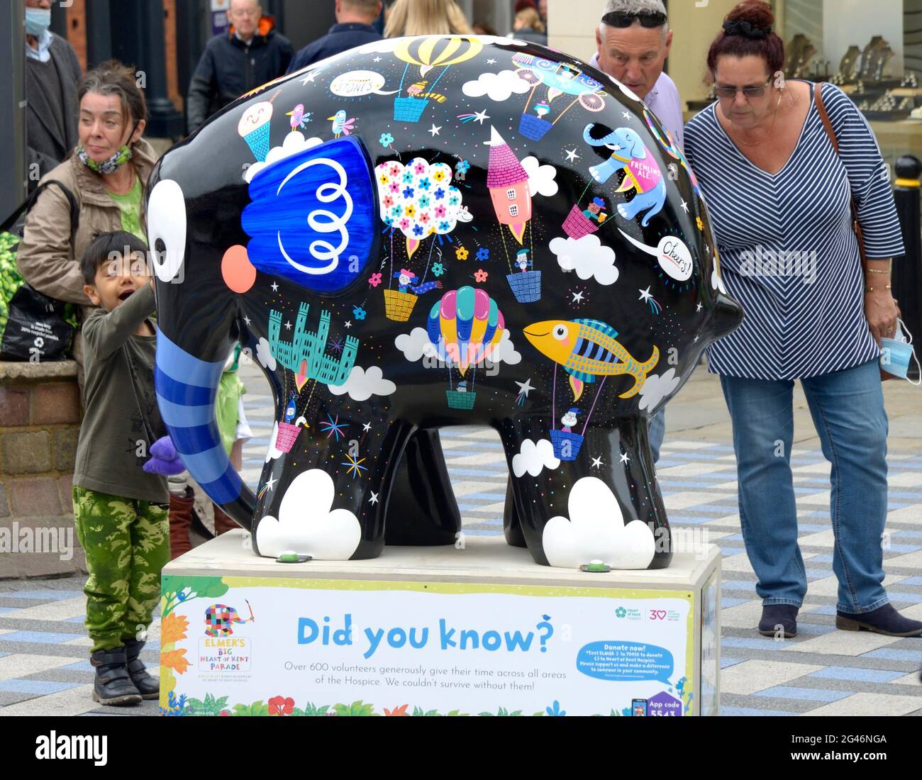 Maidstone, Kent, UK. 19th June, 2021. A huge herd of 81 colourful Elmers - based on David McKee's children's book character - appeard overnight in Maidstone, Kent, at the start of a 9 week parade in support of the Heart of Kent Hospice. The Elmers have been designed by well-known and unknown artists and will be auctioned off on August 9th September to raise funds for the Hospice. 'Never Forget' Credit: Phil Robinson/Alamy Live News Stock Photo