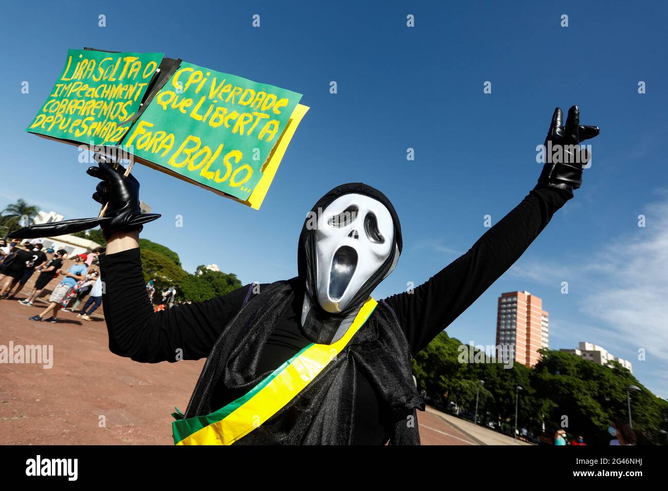 A demonstrator holds a placard reading 'Lira releases the impeachment. We will charge deputies and senators. CPI true that awakens. Out Bolso...' during a protest against Brazil's President Jair Bolsonaro's handling of the coronavirus disease (COVID-19) pandemic and to impeach him, in Goiania, Brazil, June 19, 2021. REUTERS/Diego Vara Stock Photo