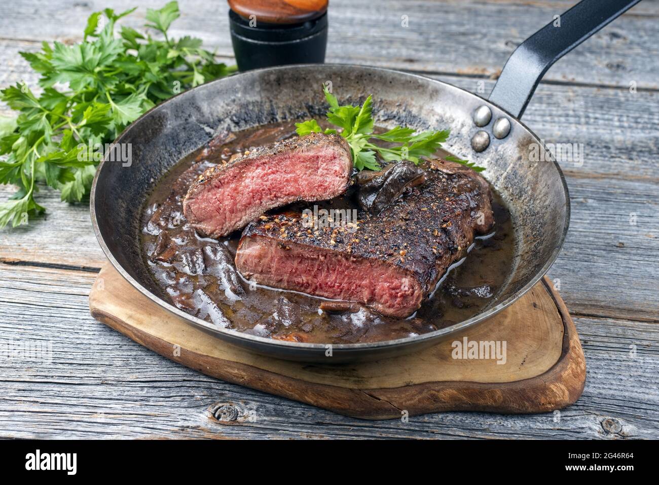 Traditional dry aged fried loin of a horse steak natural with mushroom