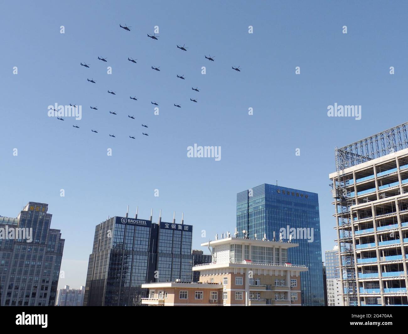 Beijing, China. 19th June, 2021. Helicopters fly over Beijing in a formation of "100" on June 19, 2021, during a rehearsal for a July event to celebrate the Chinese Communist Party's 100th anniversary. (Kyodo)==Kyodo Photo via Credit: Newscom/Alamy Live News Credit: Newscom/Alamy Live News Stock Photo