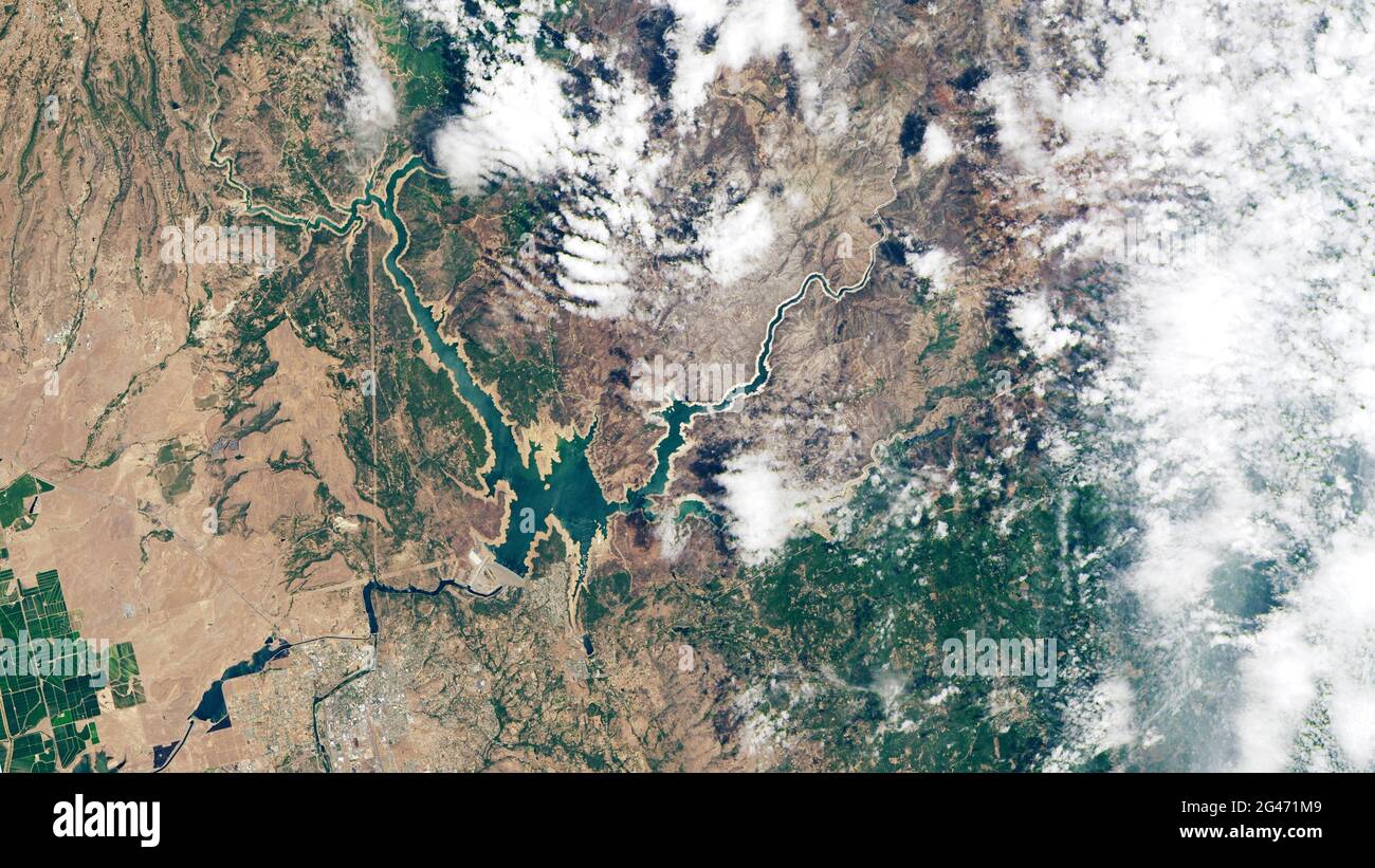 High altitude aerial of low water level drought conditions at Lake Oroville, California in June, 2021. Credit Tsado/NASA Stock Photo