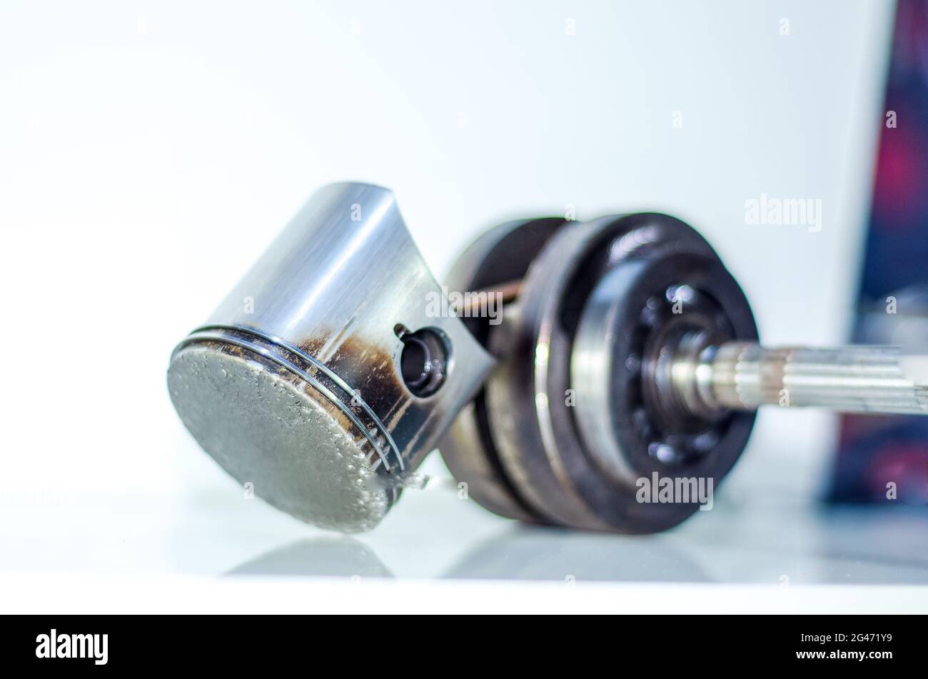 Closeup of crankshaft bearing overheating with piston impact marks on