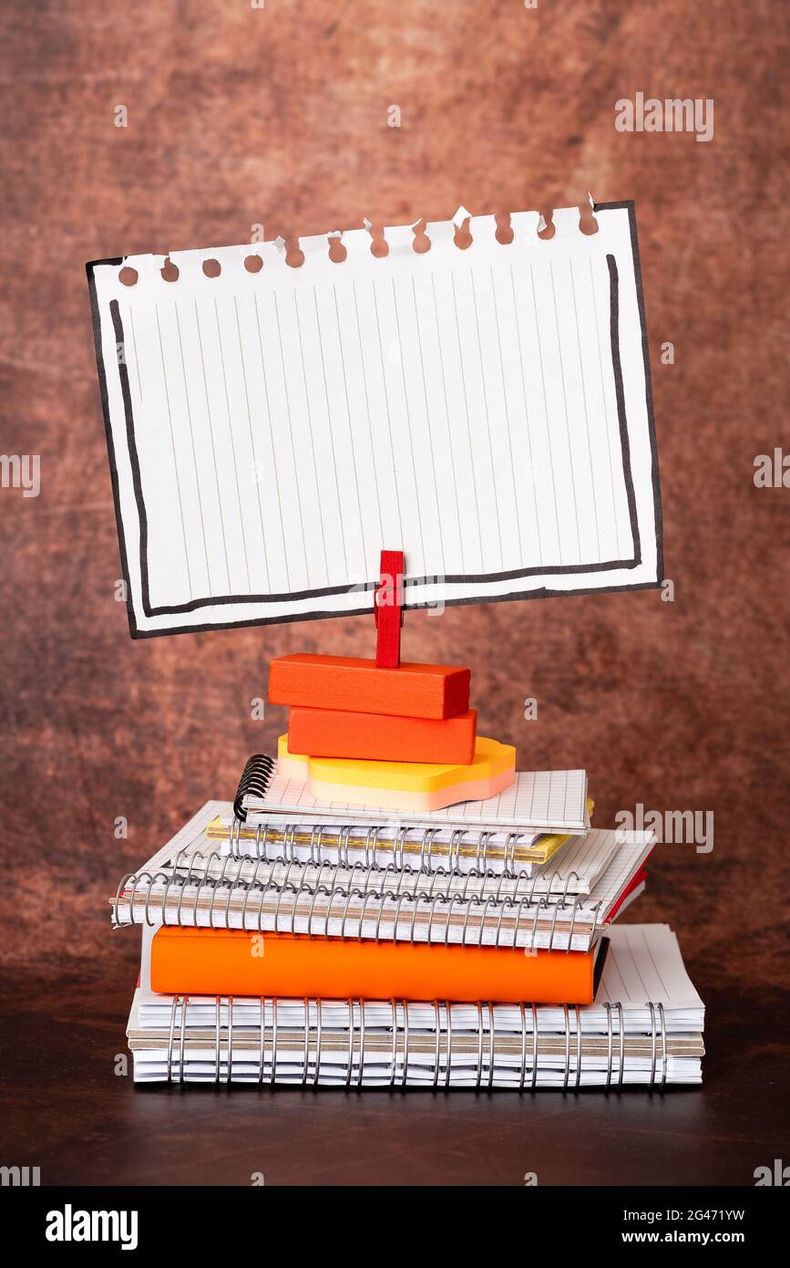 Organized Stack Note Pad, Bundle Notebooks, Neat Pile Documents, Pleasant Arrangement Writing Materials, Clean Workspace, Office Stock Photo