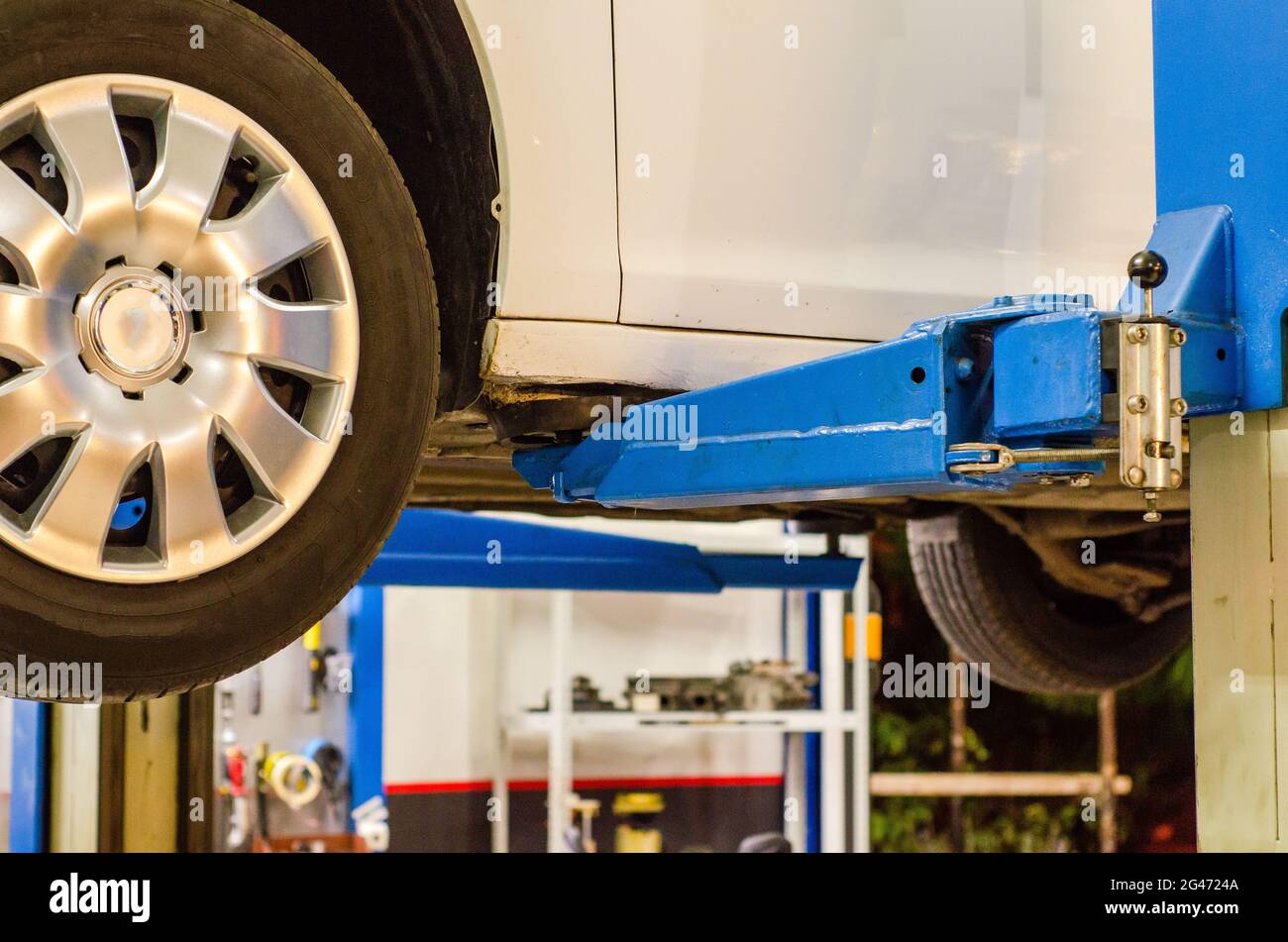 Car service hydraulic ramp lift car Stock Photo Alamy