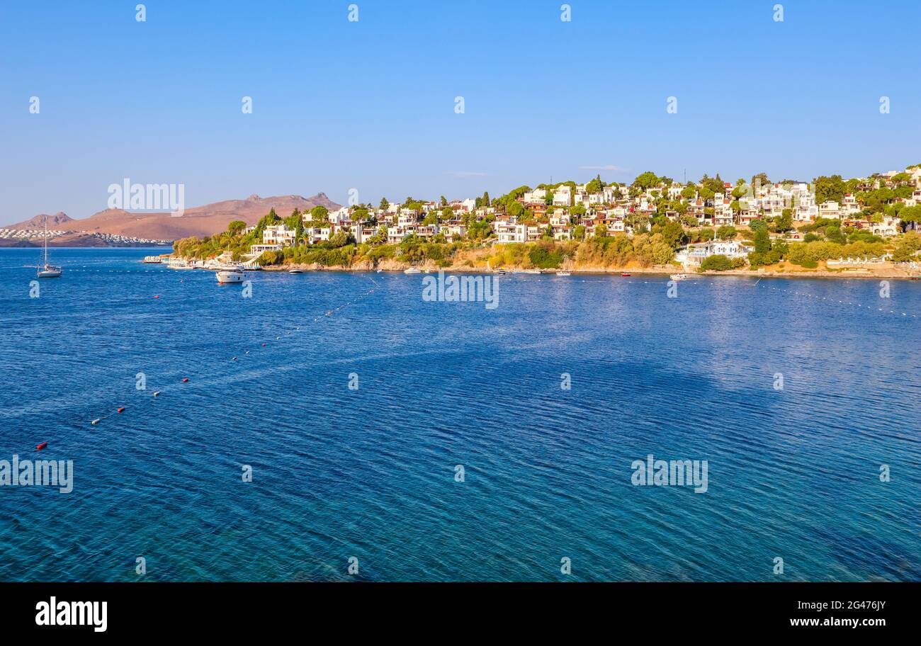 Aegean coast with marvelous blue water, rich nature, islands, mountains and small white houses Stock Photo
