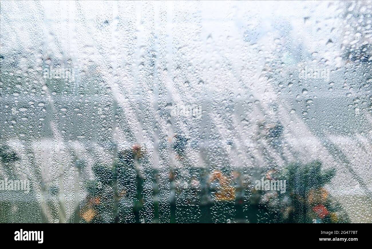 Misty Glass Window With Dripping Rain Drops On A Rainy Day Stock Photo 