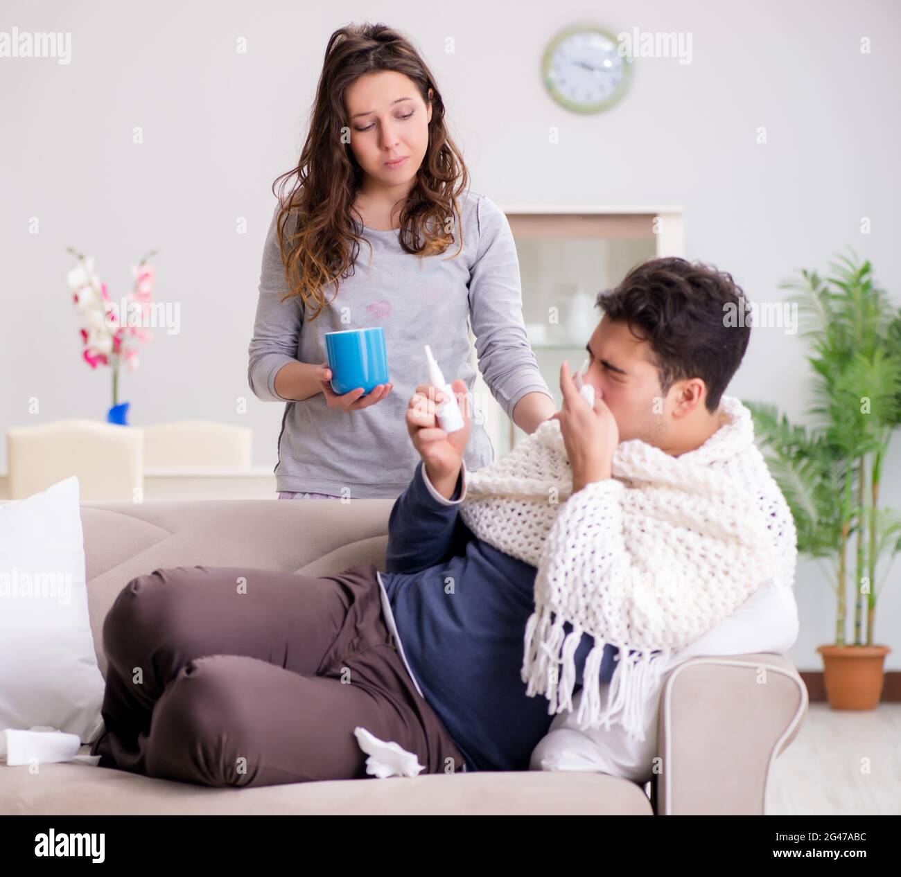 The wife caring for sick husband at home Stock Photo - Alamy