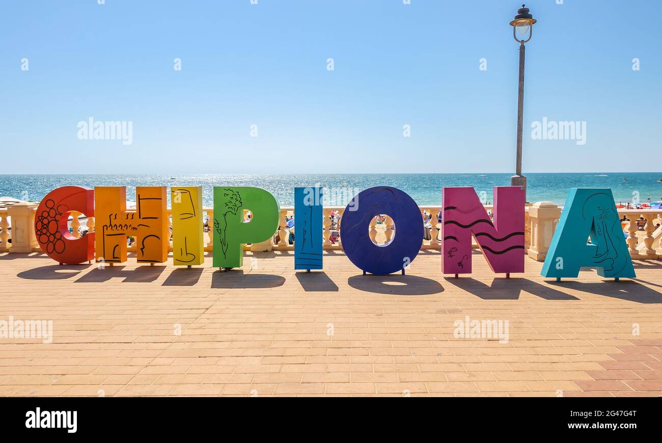 Chipiona, Cadiz, Spain - June 13, 2021: Multi Colored sign with the name of Chipiona at the access to one of its beaches, Cadiz, Andalucia, Spain Stock Photo