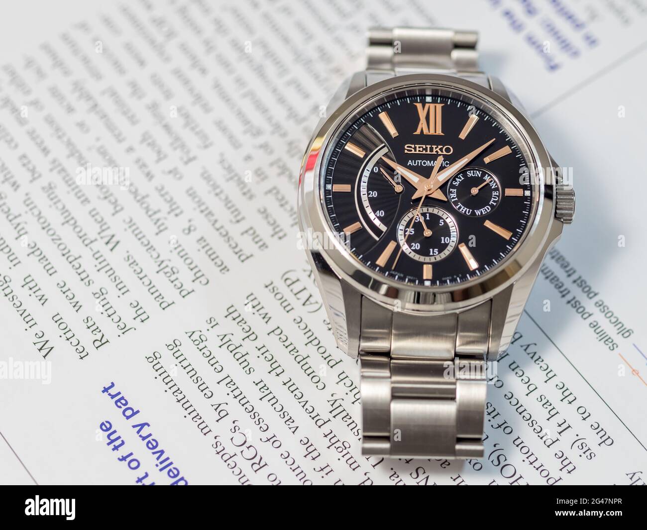 BANGKOK - DECEMBER 3 : Seiko automatic watch, black dial with subdial day,  date and power reserve indicator on English paper, selective focus on its b  Stock Photo - Alamy