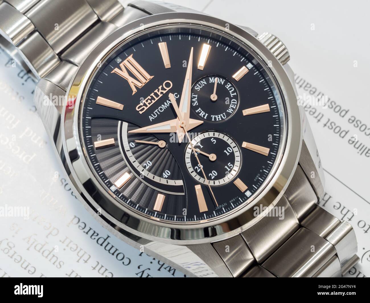 BANGKOK - DECEMBER 3 : Seiko automatic watch, black dial with subdial day,  date and power reserve indicator on English paper, selective focus on its b  Stock Photo - Alamy
