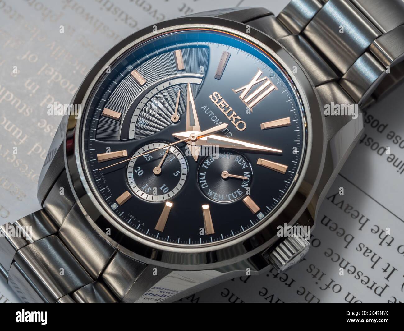 BANGKOK - DECEMBER 3 : Seiko automatic watch, black dial with subdial day,  date and power reserve indicator on English paper, selective focus on its b  Stock Photo - Alamy