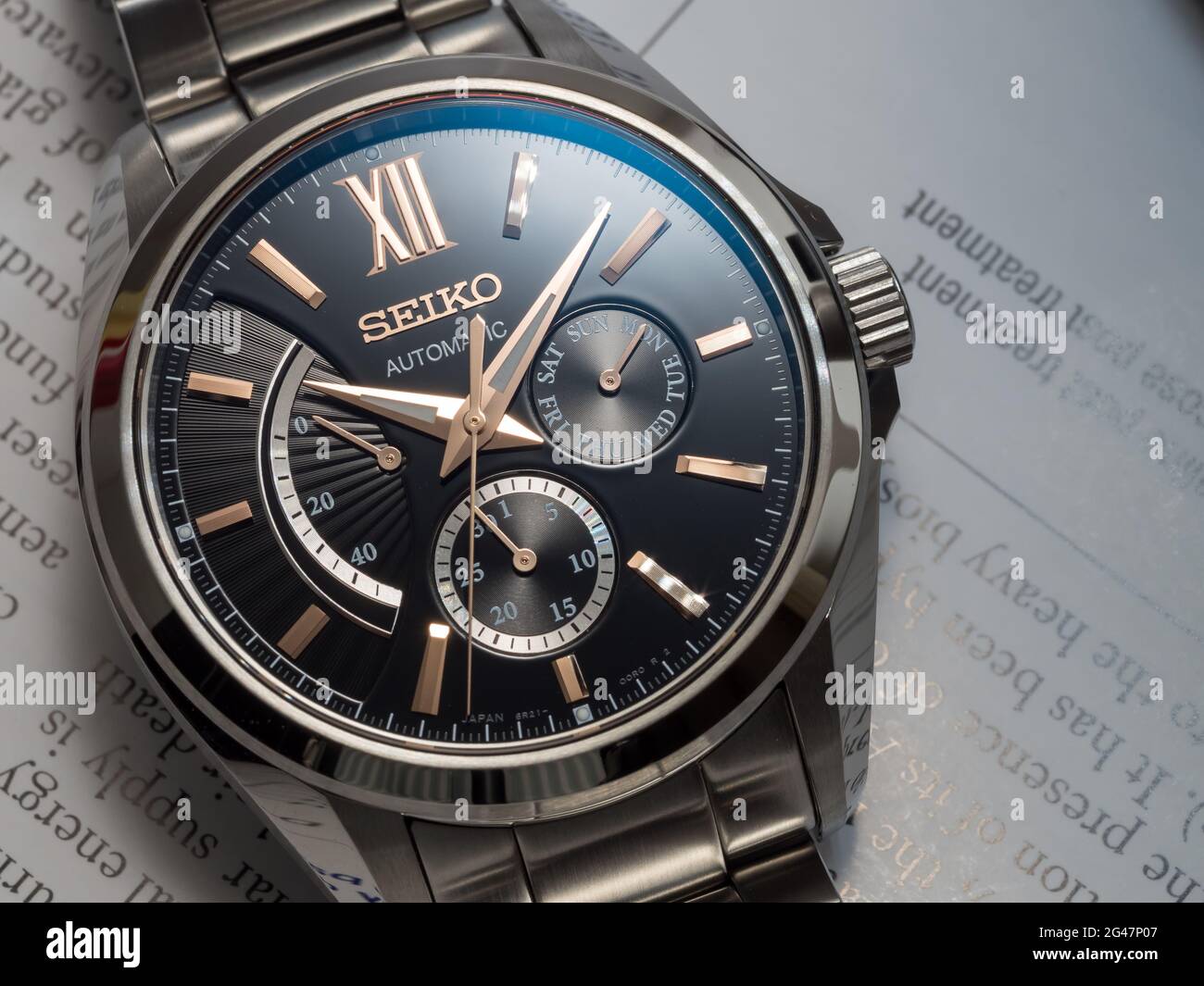 BANGKOK - DECEMBER 3 : Seiko automatic watch, black dial with subdial day,  date and power reserve indicator on English paper, selective focus on its b  Stock Photo - Alamy
