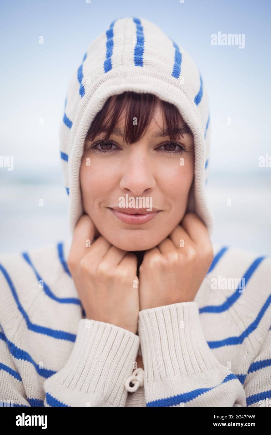 Close up portrait of woman wearing hooded sweater during winter Stock Photo