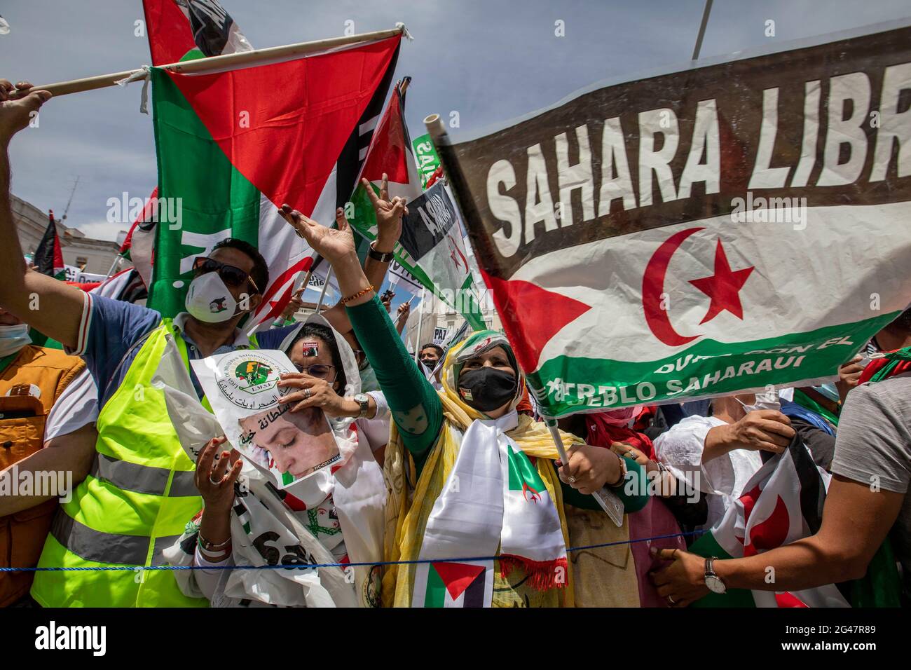 Protesters hold Saharawi flags while shouting slogans during the ...
