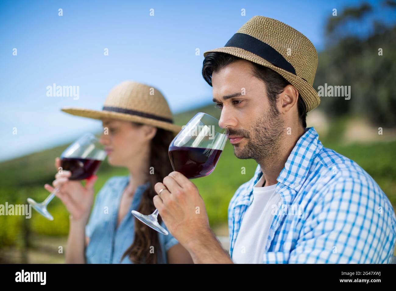 Thoughtful man smelling red wine in glass Stock Photo - Alamy