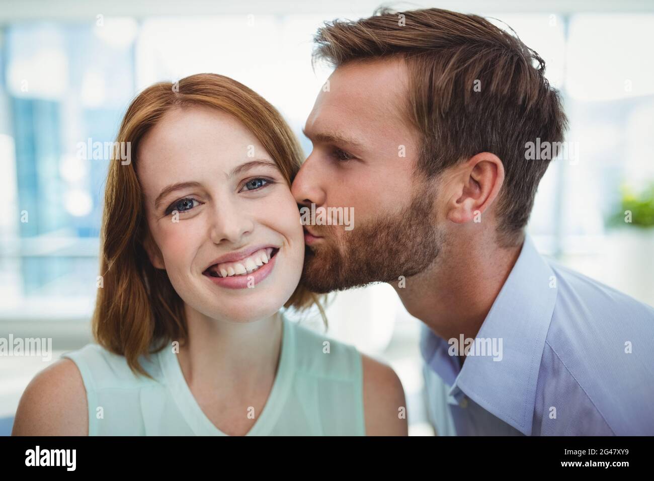 Young professional couple kissing hi-res stock photography and images ...