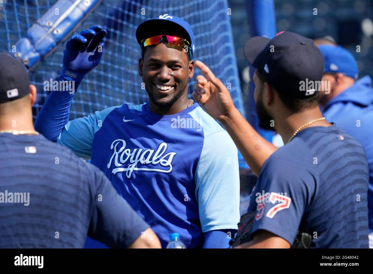 Kansas City, MO, USA. 18th June, 2021. Kansas City Royals Jorge Soler (12)  relaxes with a few Boston Red Sox players during pre-game batting practice  at Kauffman Stadium in Kansas City, MO.