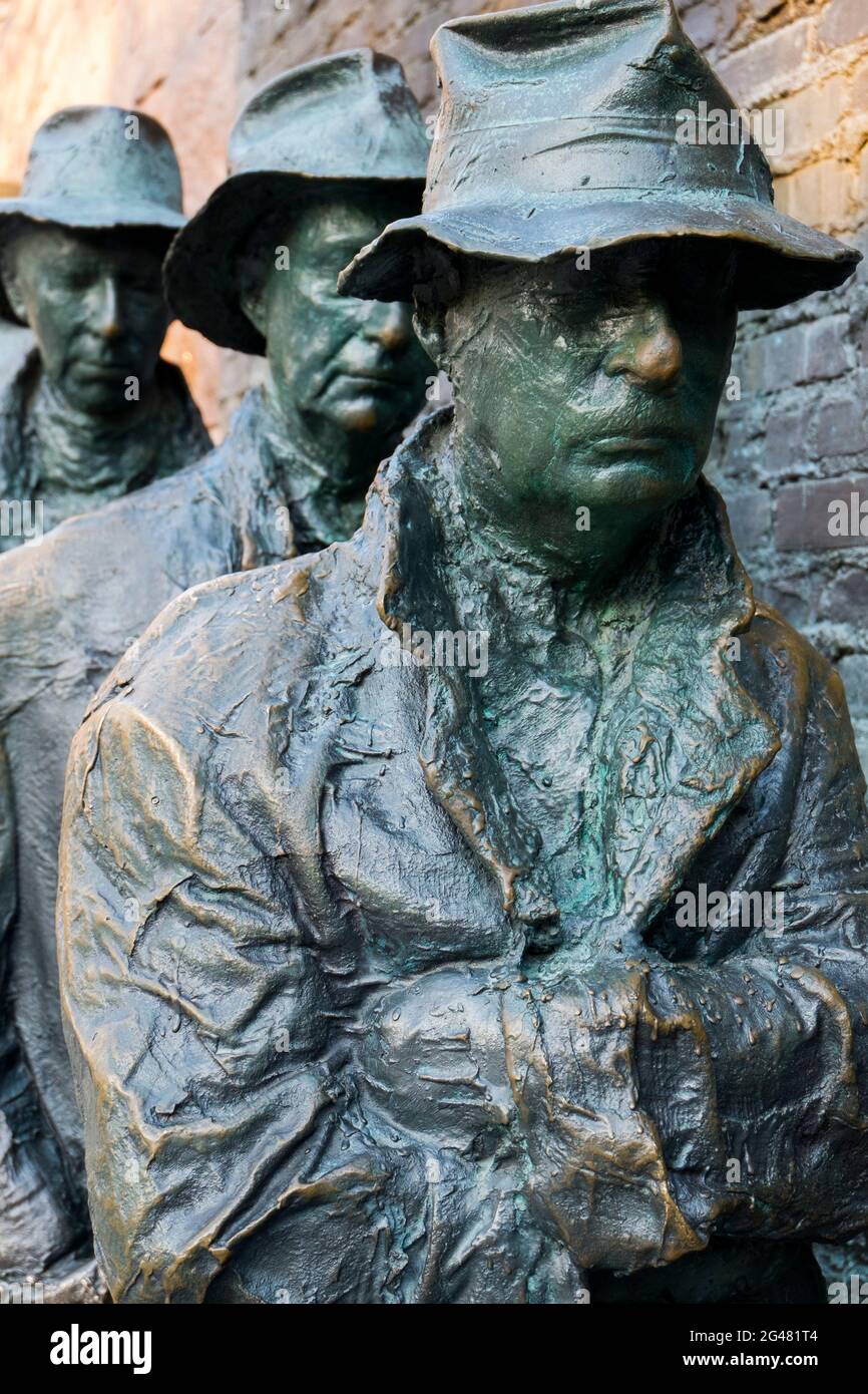 The bronze sculpture of people lined up in a Depression era bread line for food. At the FDR Memorial at the Mall in Washington DC. Stock Photo