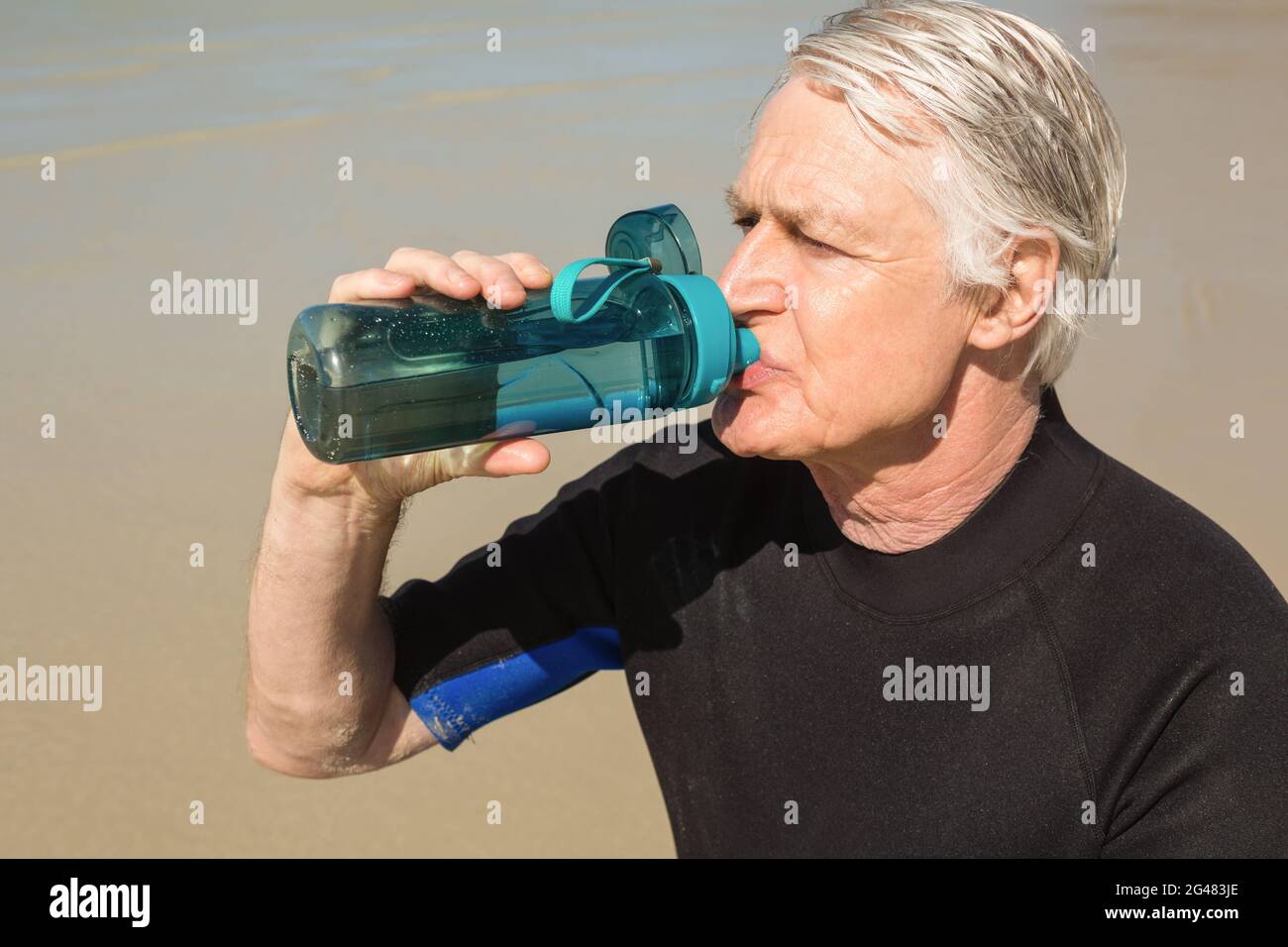 Man bottle of water suit hi-res stock photography and images - Alamy