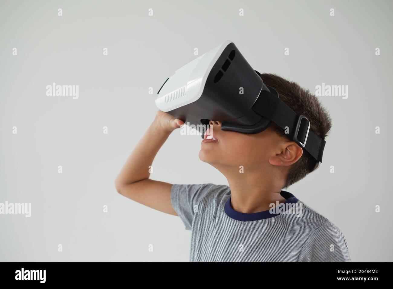 Schoolboy using virtual reality headset Stock Photo