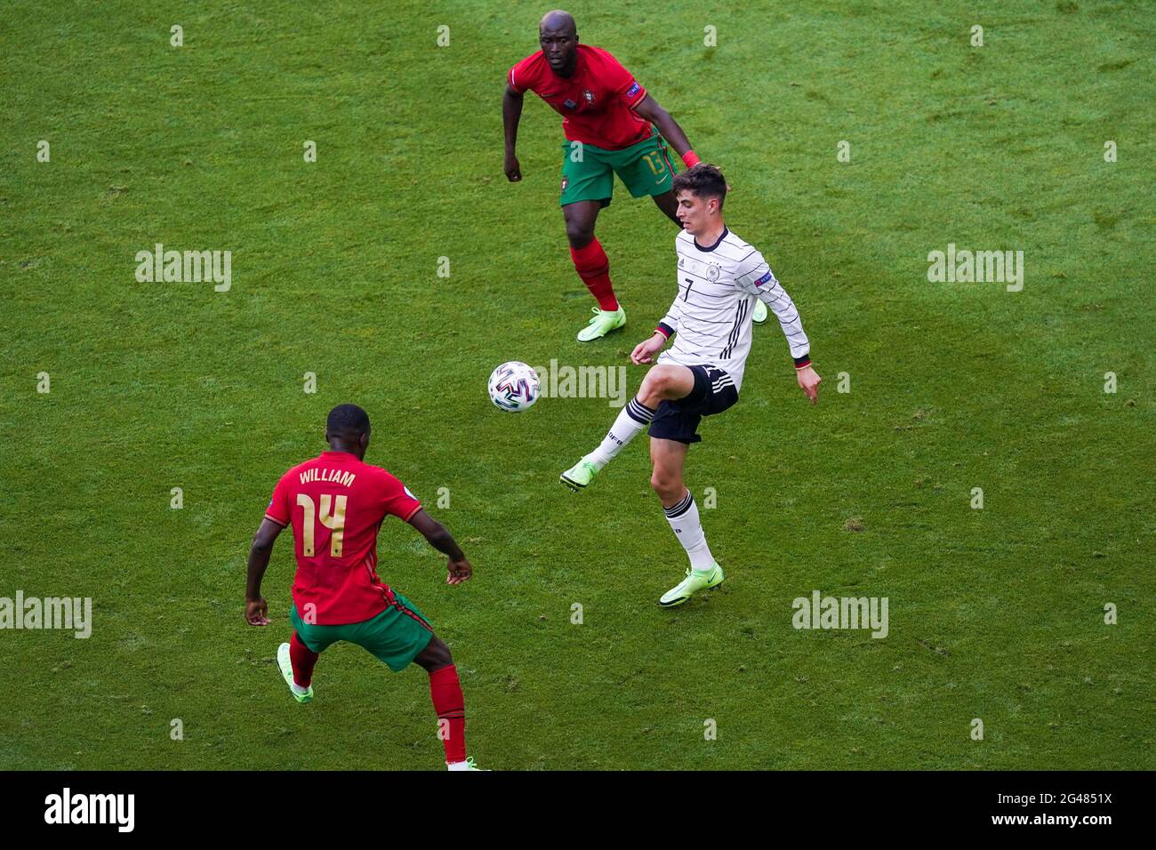 MUNCHEN, GERMANY - JUNE 19: Kai Havertz of Germany battles for possession with William Carvalho of Portugal and Danilo of Portugal during the UEFA Euro 2020 Group F match between Portugal and Germany at Allianz Arena on June 19, 2021 in Munchen, Germany (Photo by Andre Weening/Orange Pictures) Stock Photo