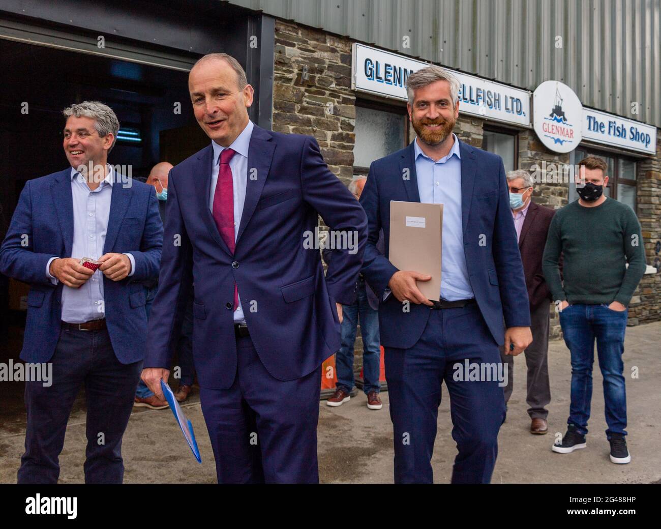 Union Hall, West Cork, Ireland, Saturday 19th June 2021. The Taoiseach Micheál Martin paid a surprise visit to Keelbeg Pier Union Hall this evening too meet the fishermen of the Union Hall fishing fleet. He took the opportunity to listen to the fishermens ongoing issues with quota’s and weighing in catches on the quayside. He also took the chance to meet the wives and children.  Credit aphperspective/ Alamy Live News Stock Photo