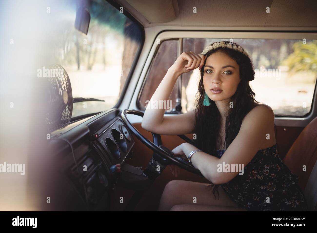 Portrait of beautiful woman leaning on steering wheel Stock Photo Alamy