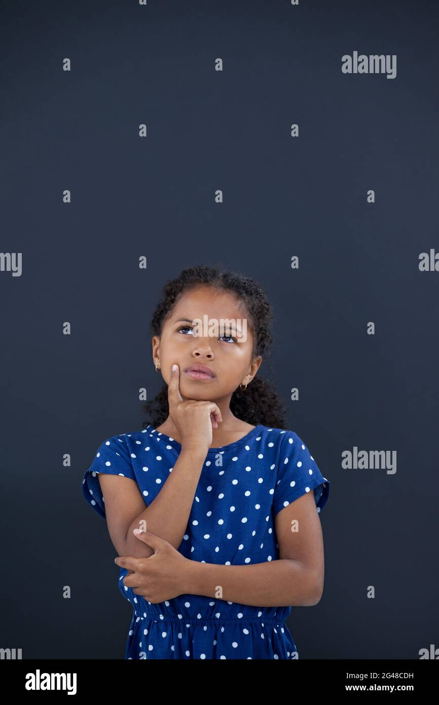 Hand on chin girl thinking hi-res stock photography and images - Alamy
