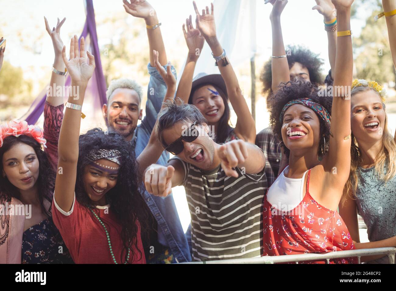 Portrait of cheerful friends enjoying during music festival Stock Photo ...