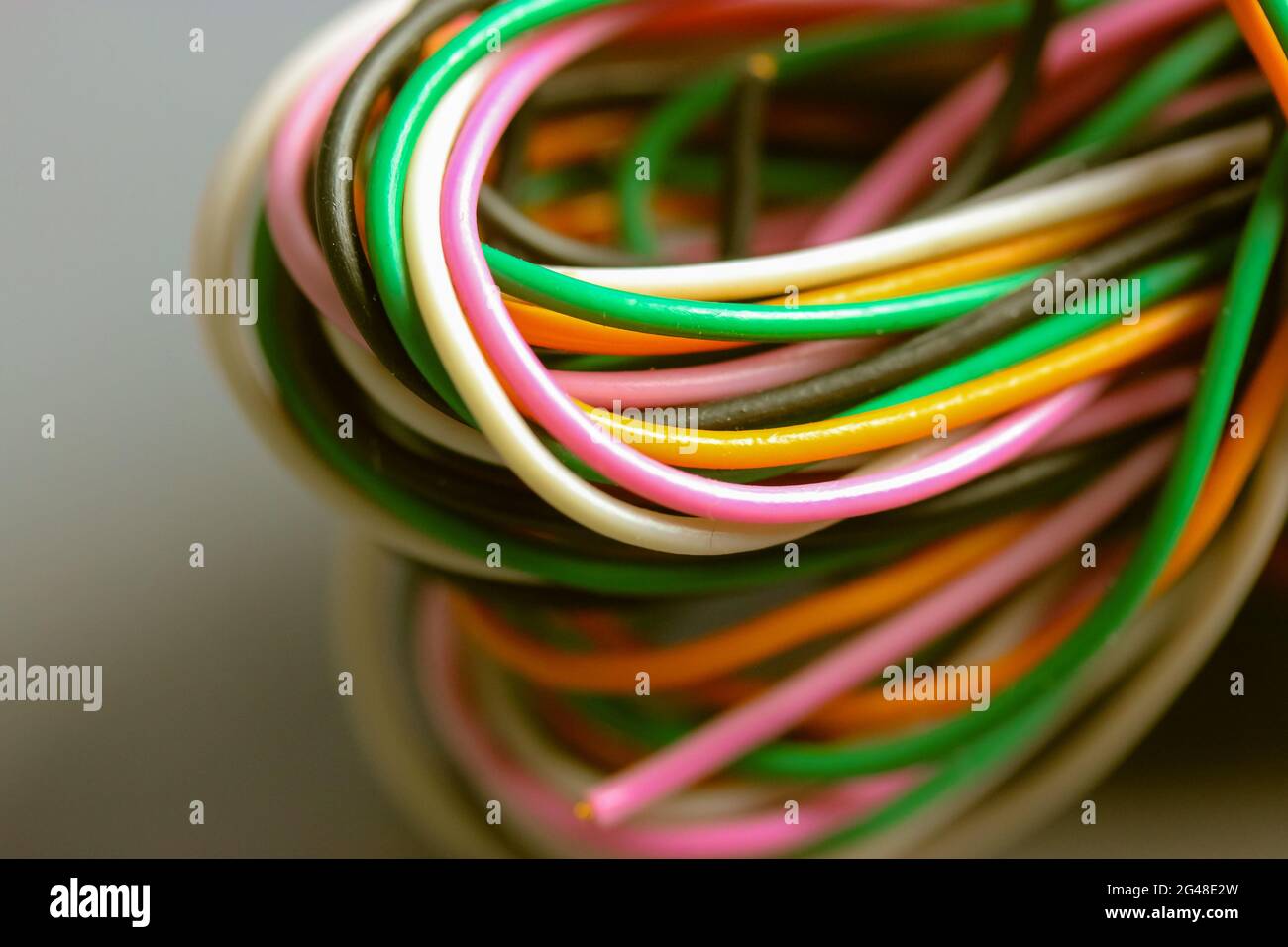 A bundle of multicolored electrical, car, computer, telephone wires