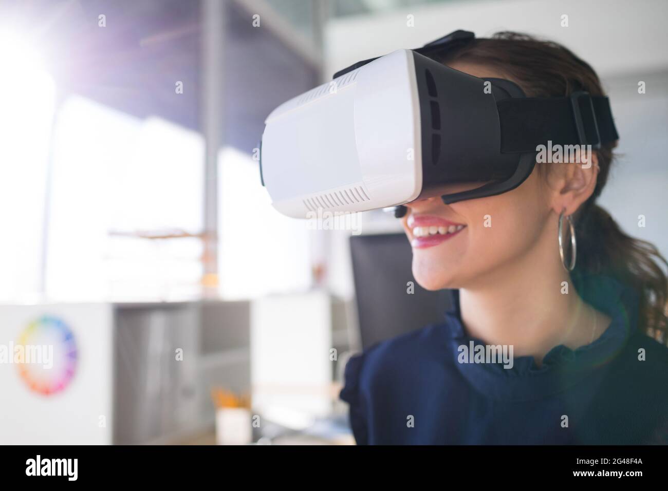 Female architect using virtual reality headset Stock Photo