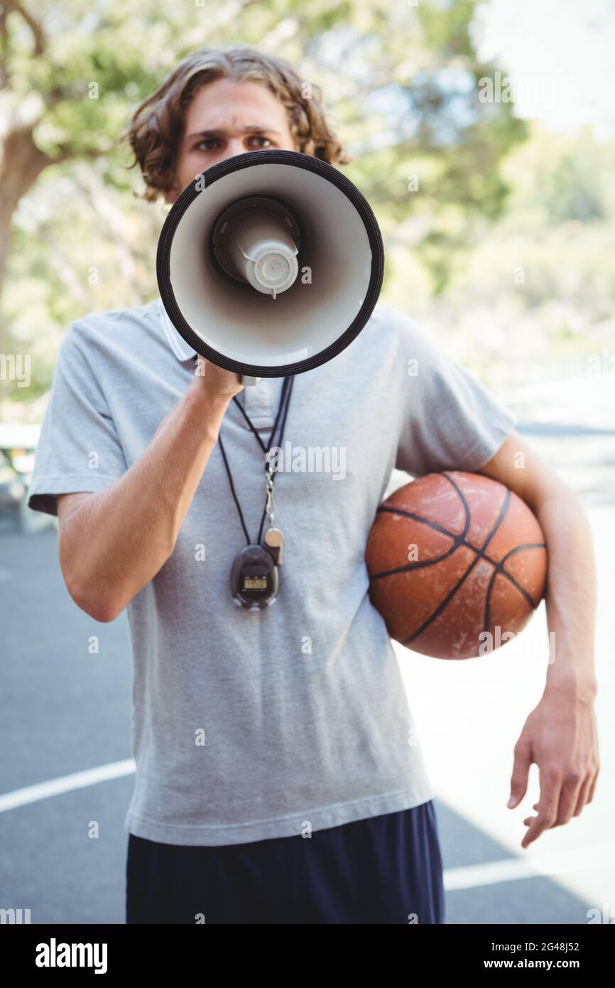 Male basketball coach using megaphone Stock Photo Alamy