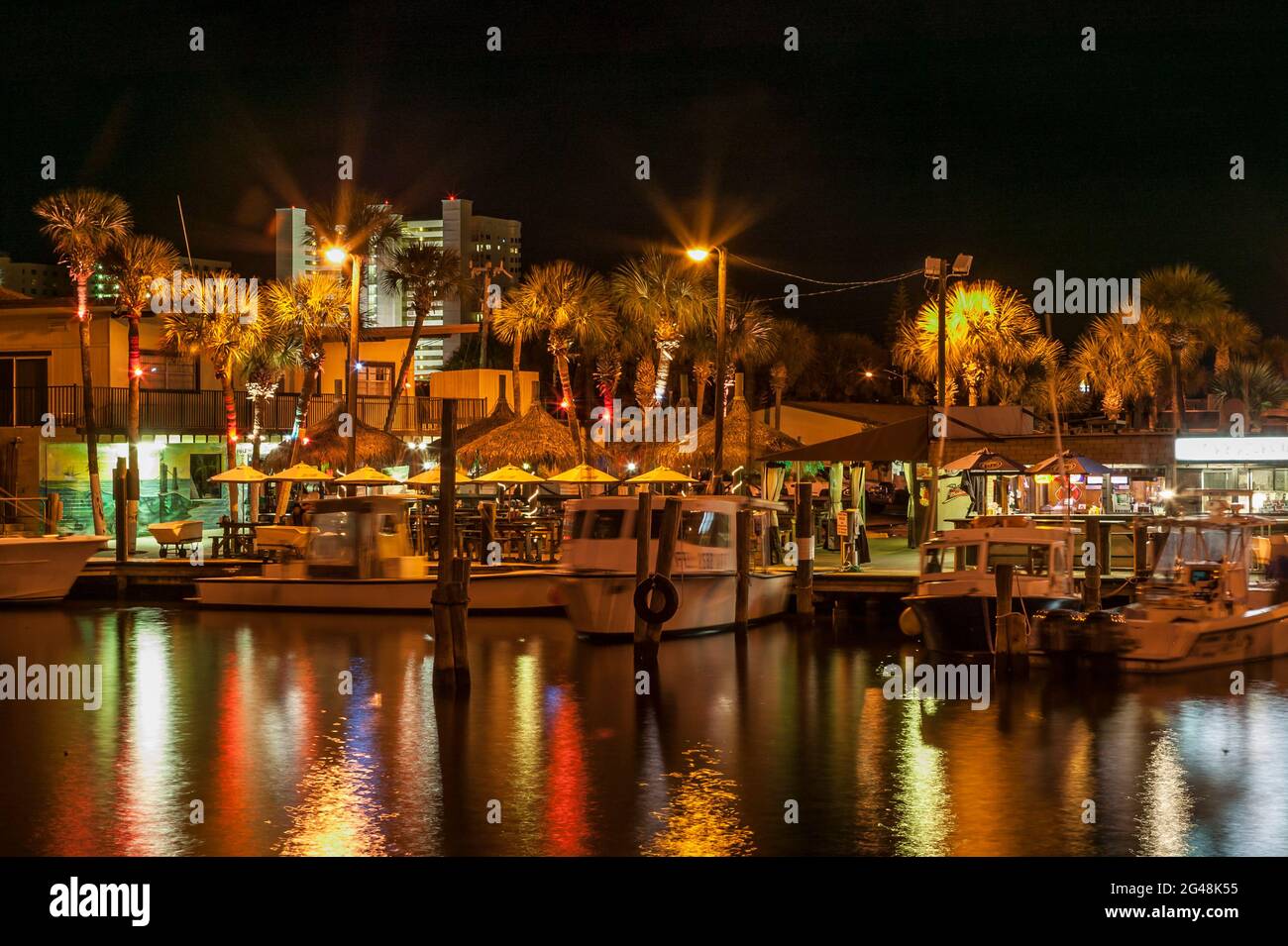 Marina and outside dining at nigh along the Halifax River, Daytona Beach, Florida, USA Stock Photo