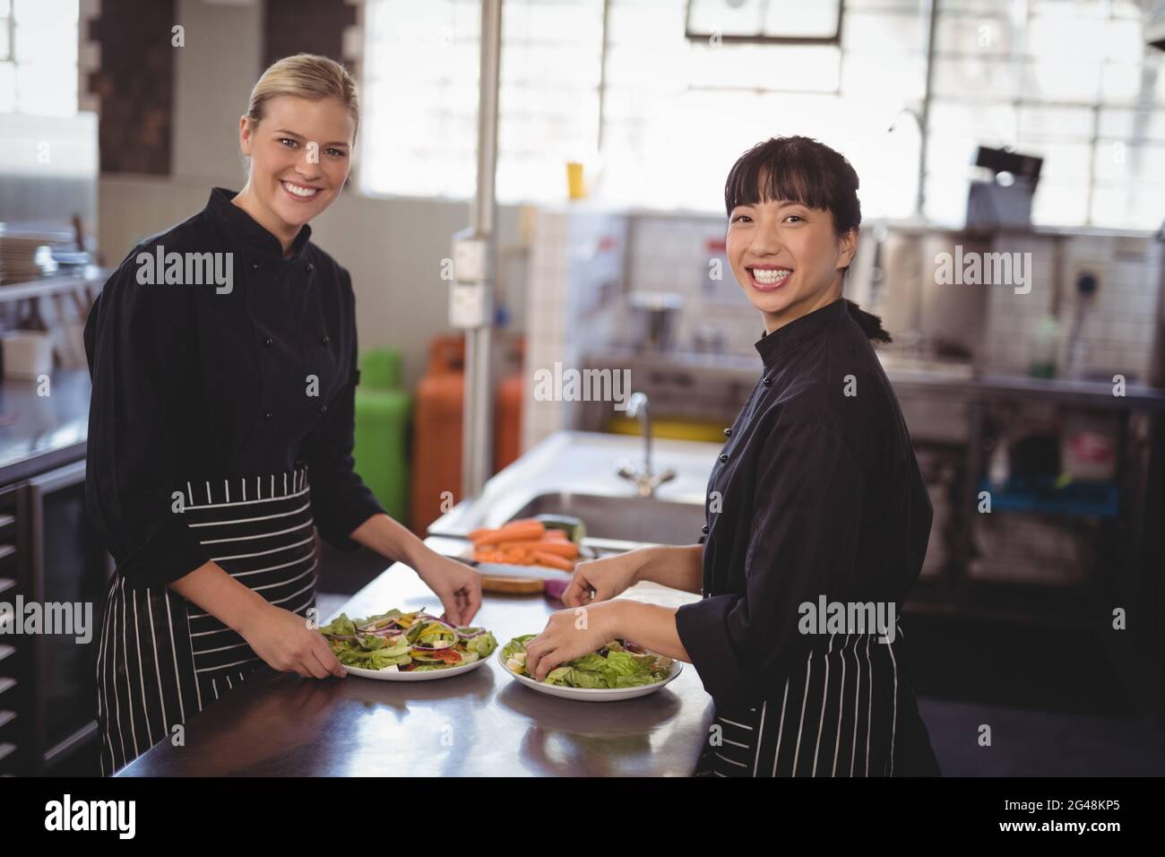 Two pretty female chefs looking hi-res stock photography and images - Alamy