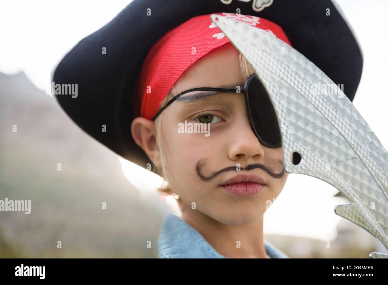 Close up portrait of boy wearing pirates costume Stock Photo