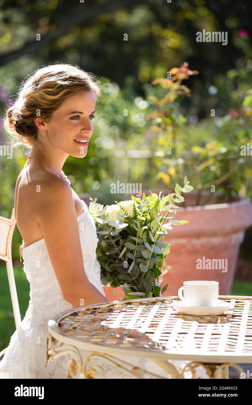 Bride sitting on chair hi-res stock photography and images - Alamy