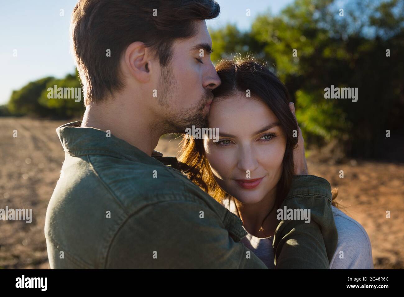 Millennial man kissing woman hi-res stock photography and images - Alamy