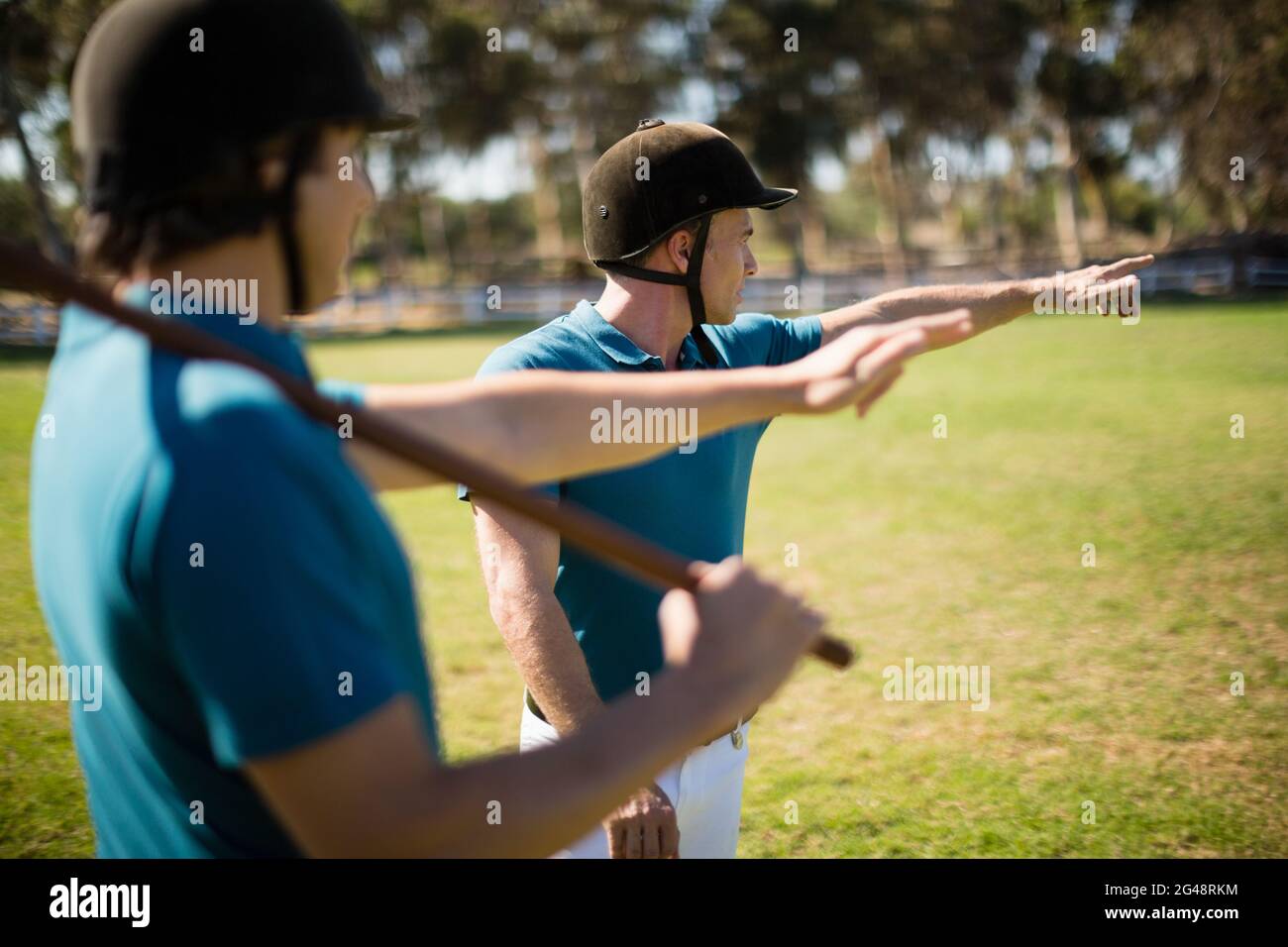 Tow male jockey talking to each other Stock Photo