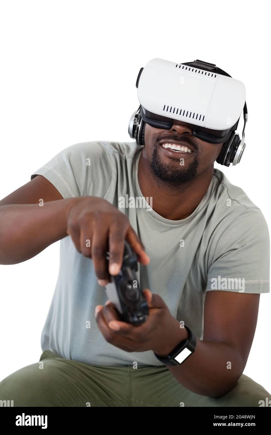 Man using virtual reality headset and playing video game Stock Photo