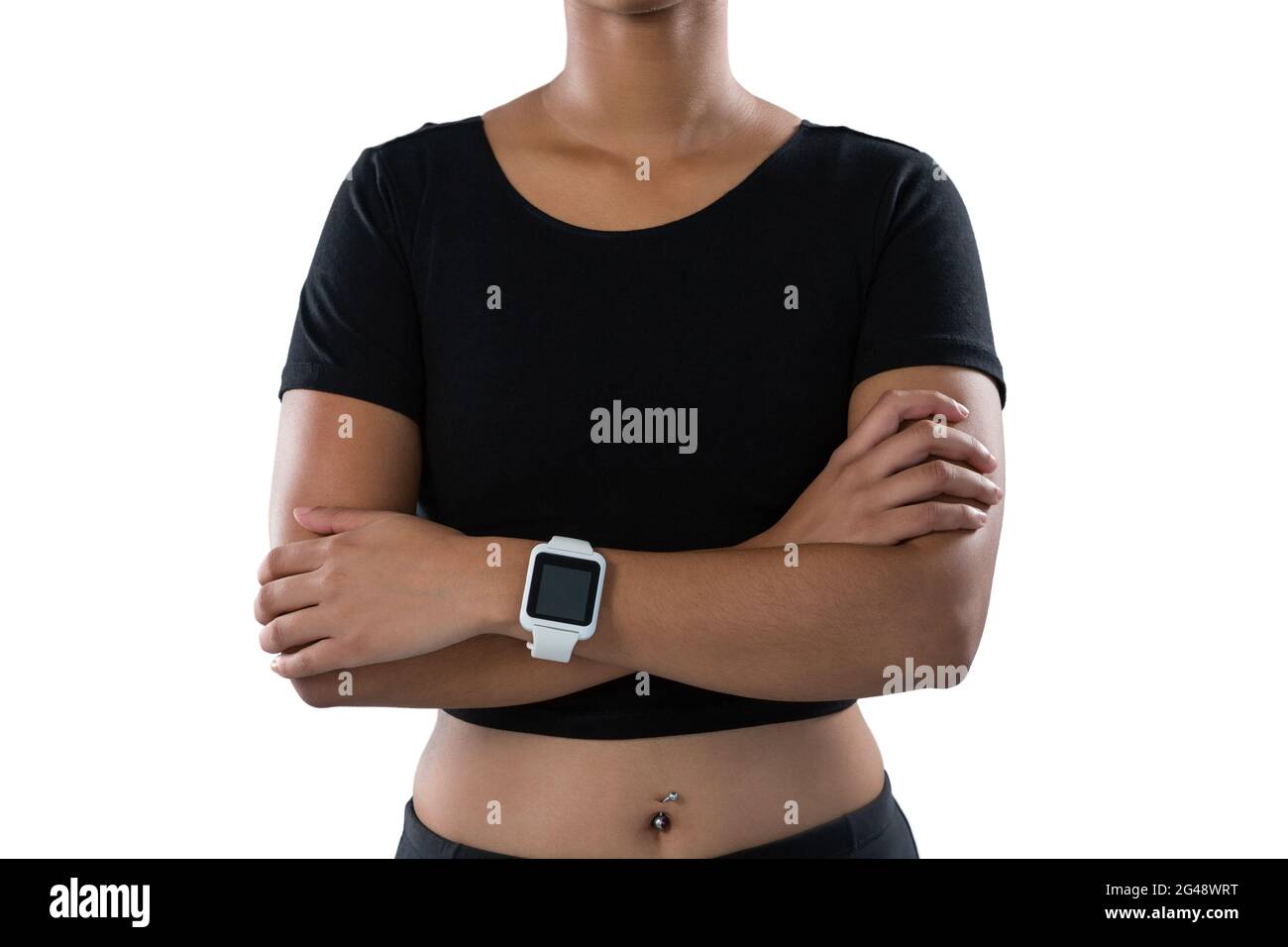 Female athlete standing with arms crossed Stock Photo - Alamy