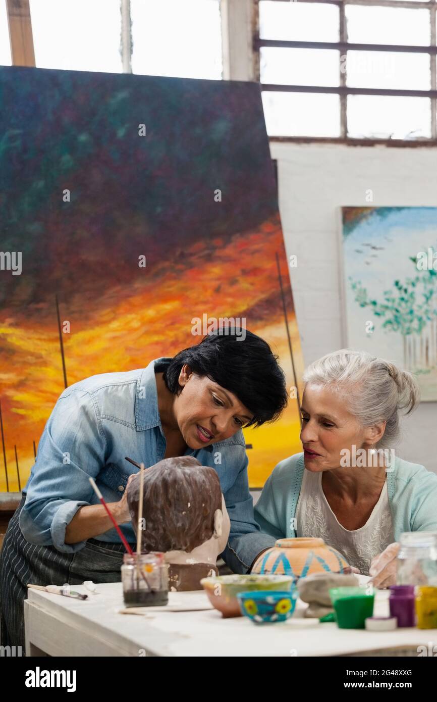 Woman Painting A Sculptor Stock Photo Alamy