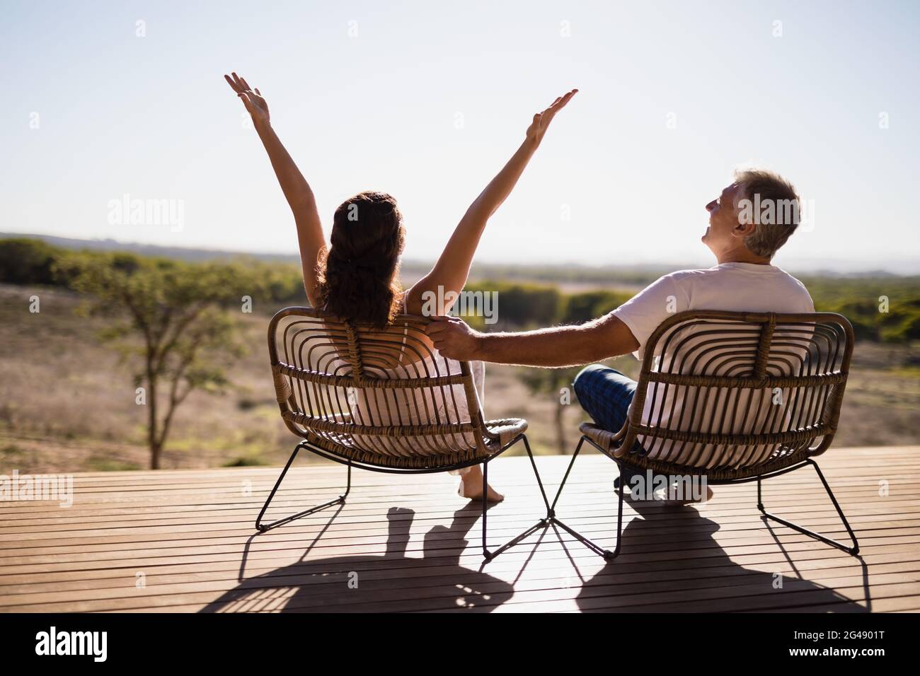 Senior couple sitting on chairs at the resort Stock Photo - Alamy