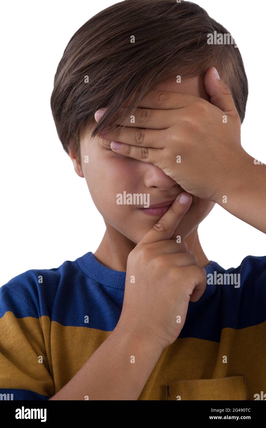 Cute boy covering his eyes Stock Photo - Alamy
