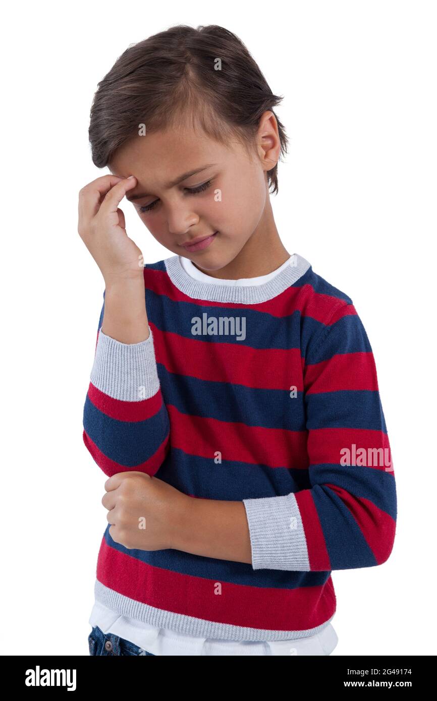 Cute boy having an headache Stock Photo - Alamy