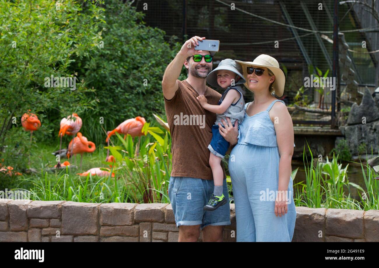Toronto, June 19. 23rd Nov, 2020. A family poses for a selfie at the Toronto Zoo in Toronto, Canada, on June 19, 2021. The Toronto Zoo officially reopened to the public on Saturday after being closed to visitors since November 23, 2020. Credit: Zou Zheng/Xinhua/Alamy Live News Stock Photo