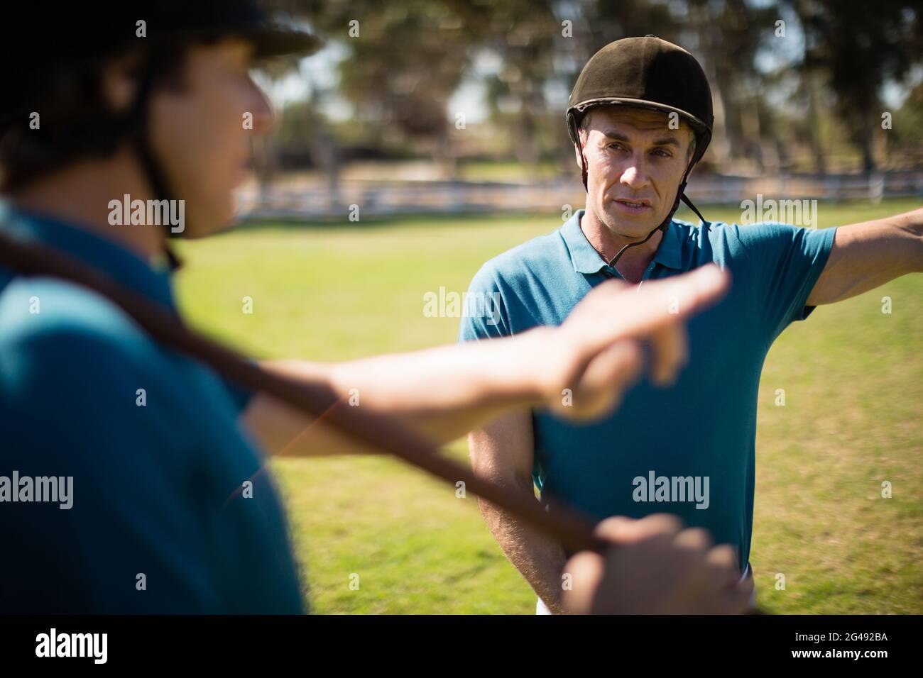 Tow male jockey talking to each other Stock Photo